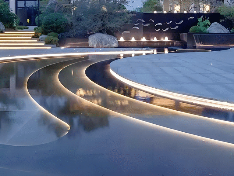 outdoor fountain lighting design with illuminated water features at night